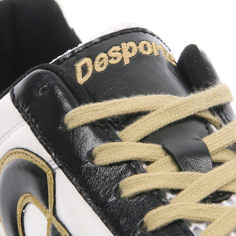 Black and gold turf sales shoes
